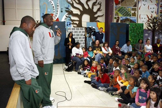Duke Johnson and Shayon Green talk to kids at First Ward Creative Arts Academy