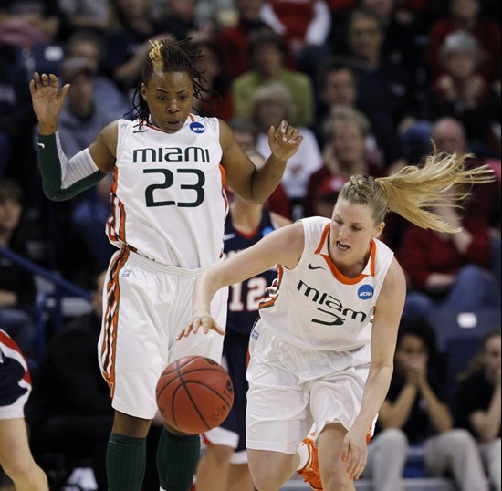Miami's Stefanie Yderstrom, right, grabs a loose ball in front of Shanel Williams against Gonzaga in the second half of an NCAA tournament...