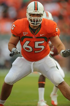 University of Miami Hurricanes offensive lineman Brandon Linder #65 gets set to block in a game against the Boston College Eagles at Sun Life Stadium...