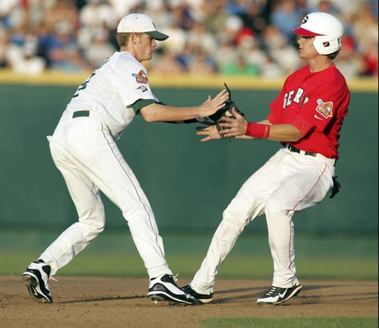 Georgia's Gordon Beckham, right, is caught stealing second base by Miami shortstop Ryan Jackson in the sixth inning of an NCAA College World Series...