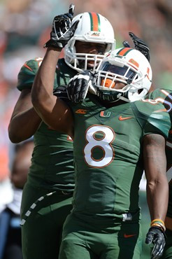 University of Miami Hurricanes running back Duke Johnson #8 scores a touchdown in a game against the North Carolina Tar Heels at Sun Life Stadium on...