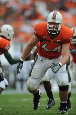 University of Miami Hurricanes offensive tackle Jason Fox #64 plays in a game against the Virginia Cavaliers at Land Shark Stadium on November 7,...