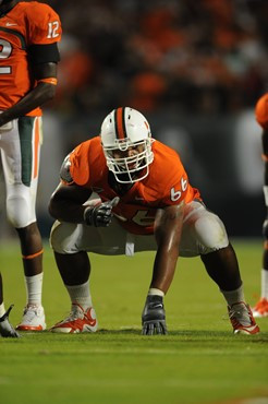 University of Miami Hurricanes offensive lineman Harland Gunn #66 gets set to block in a game against the Florida State Seminoles at Sun Life Stadium...