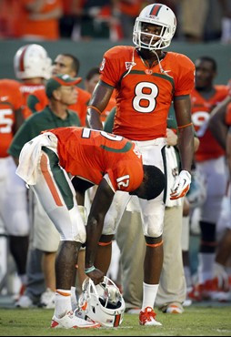 Miami quarterback Jacory Harris, front, and Tommy Streeter (8) react after Harris was stopped at the goal line by Kansas State's Tre Walker during the...