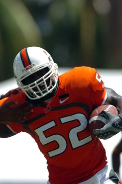 University of Miami linebacker Tavaris Gooden #52 makes an interception and returns it for 35 yards against Marshall University at the Orange Bowl on...