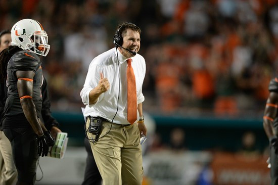University of Miami Hurricanes head coach Al Golden leads his team on the field in a game against the Duke Blue Devils at Sun Life Stadium on...