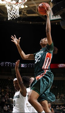 Miami's Morgan Stroman (32) puts up a fast-break layup against Michigan State's Kiana Johnson during the first half. (AP Photo/Al Goldis)