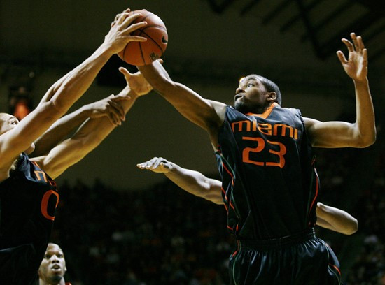 Jimmy Graham, left, and James Dews, right, grab a rebound during their game against Virginia Tech at Cassell Coliseum in Blacksburg. (AP Photo/The...