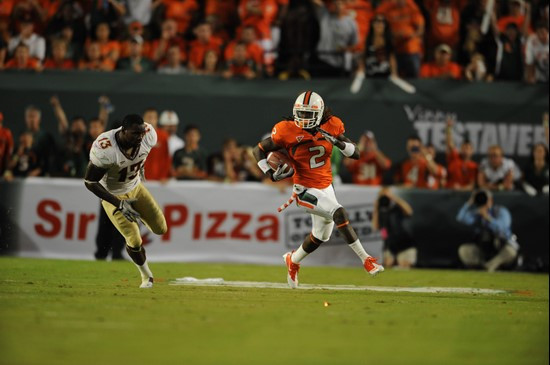 University of Miami Hurricanes running back Graig Cooper #2 carries the ball in a game against the Florida State Seminoles at Sun Life Stadium on...
