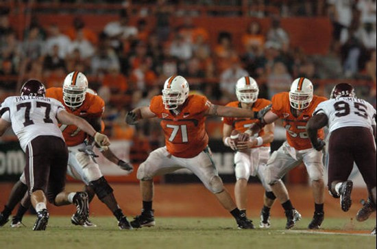 University of Miami offensive lineman Derrick Morse #71 and Reggie Youngblood #77 get set to block in a game against the Texas A&M Aggies at the...
