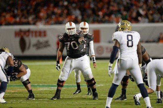 University of Miami Hurricanes offensive lineman Jonathan Feliciano #70 plays in a game against The Pittsburgh Panthers at Sun Life Stadium on...