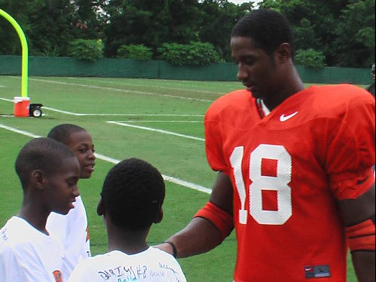 Dedrick Epps shakes a student's hand.