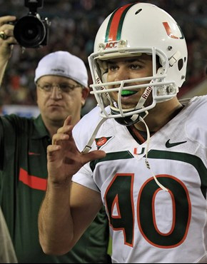 Miami kicker Jake Wieclaw smiles as he leaves the field after kicking the game-winning field goal against South Florida. (AP Photo/Chris O'Meara)