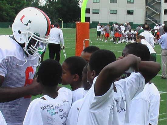 Randy Phillips autographs the students t-shirts.