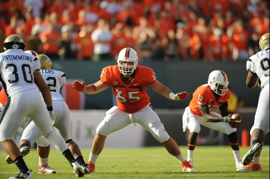 University of Miami Hurricanes offensive lineman Brandon Linder #65 gets set to block in a game against the Georgia Tech Yellow Jackets at Sun Life...