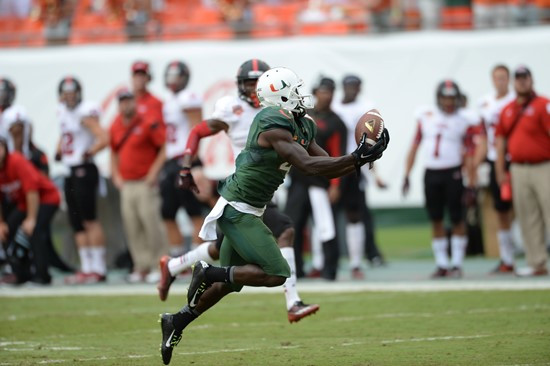 University of Miami Hurricanes wide receiver Phillip Dorsett #4 catches a pass from quarterback Brad Kaaya in a game against the Arkansas State Red...