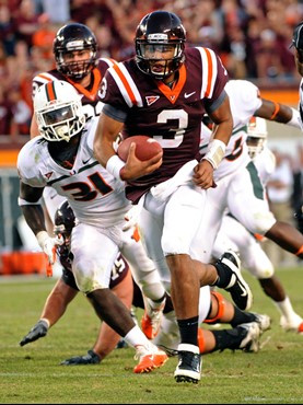 Virginia Tech quarterback Logan Thomas (3) runs ahead of Miami's Sean Spence (31) for the game-winning touchdown during the second half of an NCAA...