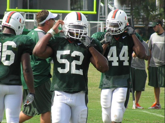 Freshman linebackers Gionni Paul, Denzel Perryman and Eddie Johnson prepare for a defensive team drill on Friday.