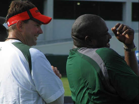 Head Coach Al Golden and Hurricane legend Warren Sapp enjoy a laugh on day seven of Fall training camp.