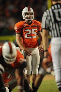 University of Miami Hurricanes kicker/punter Matt Bosher #25 kicks in a game against the Georgia Tech Yellow Jackets at Land Shark Stadium on...