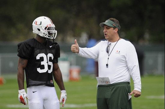 Defensive Coordinator Mark D'Onofrio and freshman LB Alex Figueroa