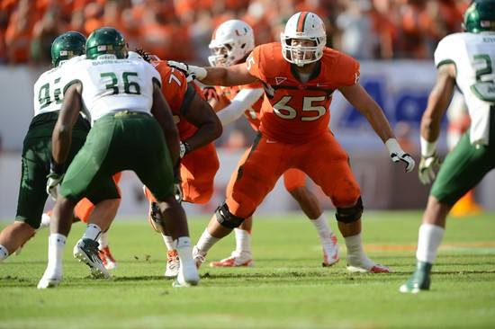 University of Miami Hurricanes offensive lineman Brandon Linder #65 gets set to block in a game against the University of South Florida Bulls at Sun...