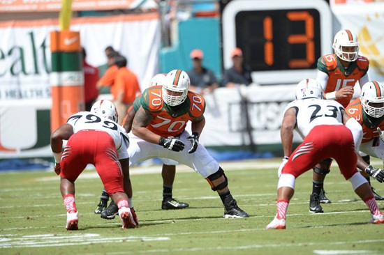 University of Miami Hurricanes offensive lineman Jonathan Feliciano #70 plays in a game against the Cincinnati Bearcats at Sun Life Stadium on October...