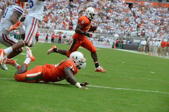 University of Miami Hurricanes running back Duke Johnson #8 scores a touchdown in a game against the #12 ranked University of Florida Gators at Sun...