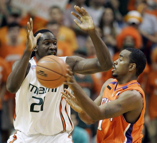 Clemson guard K.C.Rivers attempts to pass against Dwayne Collins during the first half. (AP Photo/Wilfredo Lee)
