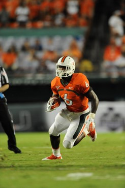University of Miami Hurricanes running back Lamar Miller #6 carries the ball against the Ohio State Buckeyes at Sun Life Stadium on September 17,...