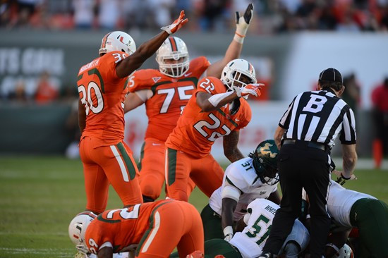 The university of Miami recover a fumble durring  the game versus University of South Florida Bulls at Sun Life Stadium on November 17, 2012.  Photo...