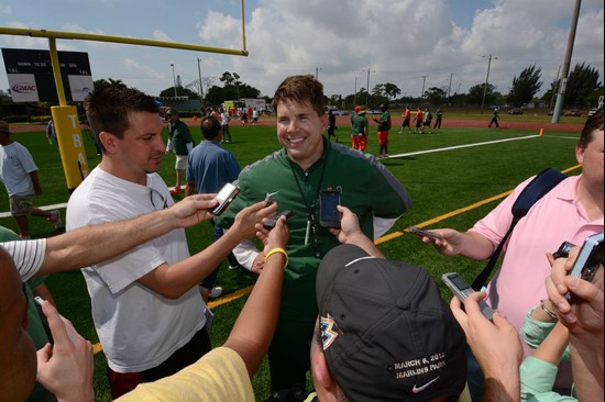 Al Golden talks to the media after Saturday's scrimmage