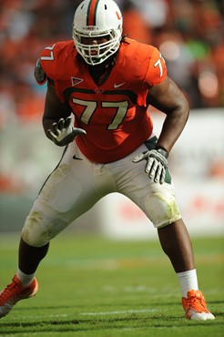 University of Miami Hurricanes offensive lineman Seantrel Henderson #77 gets set to block against the Duke Blue Devils at Sun Life Stadium on November...