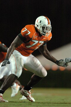 University of Miami Hurricanes offensive tackle Reggie Youngblood #77 gets set to block against the Florida International University Golden Panthers...