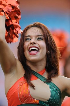 A University of Miami Hurricane cheerleader performs for fans in a game against the University of Central Florida Knights at Dolphin Stadium on...
