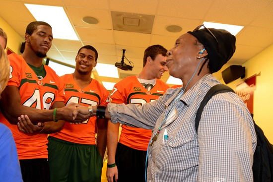 Players and coaches' wives took photos with several families Tuesday afternoon