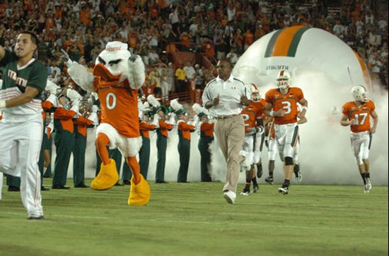 University of Miami mascot Sebastian the Ibis leads the Hurricanes through a tunnel of smoke at the beginning of a game against the Texas A&M Aggies...