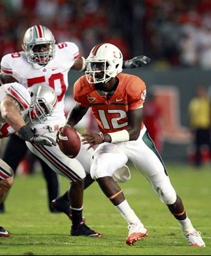 Miami quarterback Jacory Harris (12) scrambles for yardage during the second quarter of an NCAA college football game against Ohio State, Saturday,...