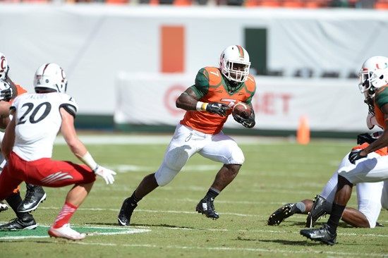 University of Miami Hurricanes running back Gus Edwards #7 and the Canes take on the Cincinnati Bearcats at Sun Life Stadium on October 11, 2014. ...