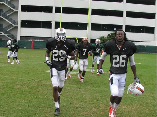 Defensive backs Ray Ray Armstrong, Jojo Nicolas and Vaughn Telemaque switch fields in between drills.