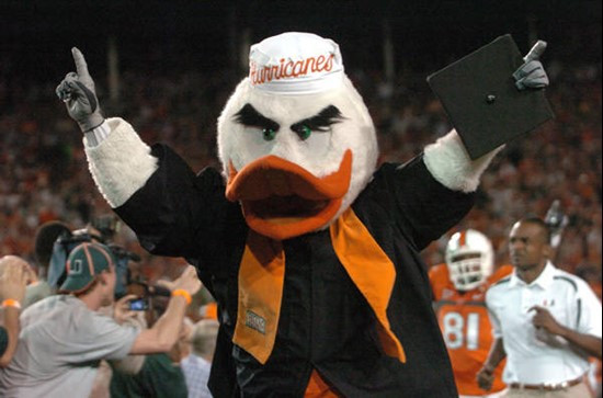 University of Miami mascot Sebastian the Ibis leads the Hurricanes through a tunnel of smoke at the beginning of a game against the Virginia Cavaliers...