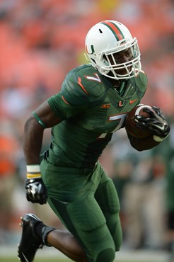 University of Miami Hurricanes running back Gus Edwards #7 scores a touchdown at the end of the first half in a game against the Arkansas State Red...