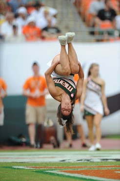 A University of Miami Hurricanes cheerleader in the air. in a game against the University of Central Florida Knights at Dolphin Stadium on October 11,...