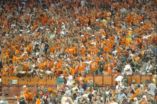 University of Miami students and fans cheer for the Hurricanes during a game against the Texas A&M Aggies at the Orange Bowl on September 20, 2007. ...