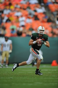 University of Miami Hurricanes quarterback Robert Marve #9 completed 11 passes on 20 attempts for 153 yards and rushed 9 times for 56 yards in a game...