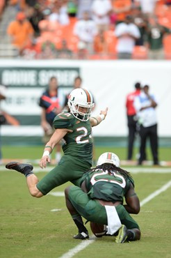 University of Miami Hurricanes Kicker/Punter Michael Badgley #24 plays in a game against the Arkansas State Red Wolves at Sun Life Stadium on...