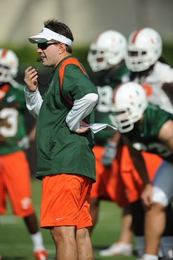 University of Miami Head Coach, Al Golden, instructs his team on how he wants them to execute his game plan during a spring practice at Greentree...