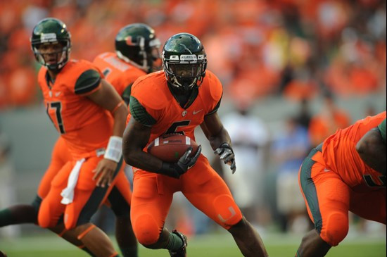 University of Miami Hurricanes running back Mike James #5 carries the ball against the Virginia Tech Hokies at Sun Life Stadium on November 20, 2010. ...