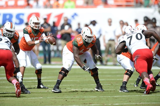 University of Miami Hurricanes offensive lineman Danny Isidora #63 plays in a game against the Cincinnati Bearcats at Sun Life Stadium on October 11,...