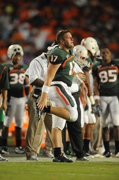 University of Miami Hurricanes quarterback Matt Perrelli #17 calls in a singnal from the sidelines in a game against the Florida A&M Rattlers at Land...